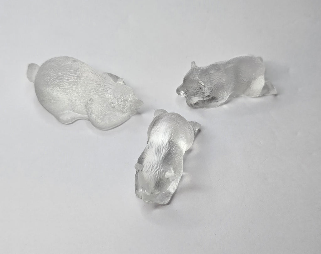 3 clear bear figurines