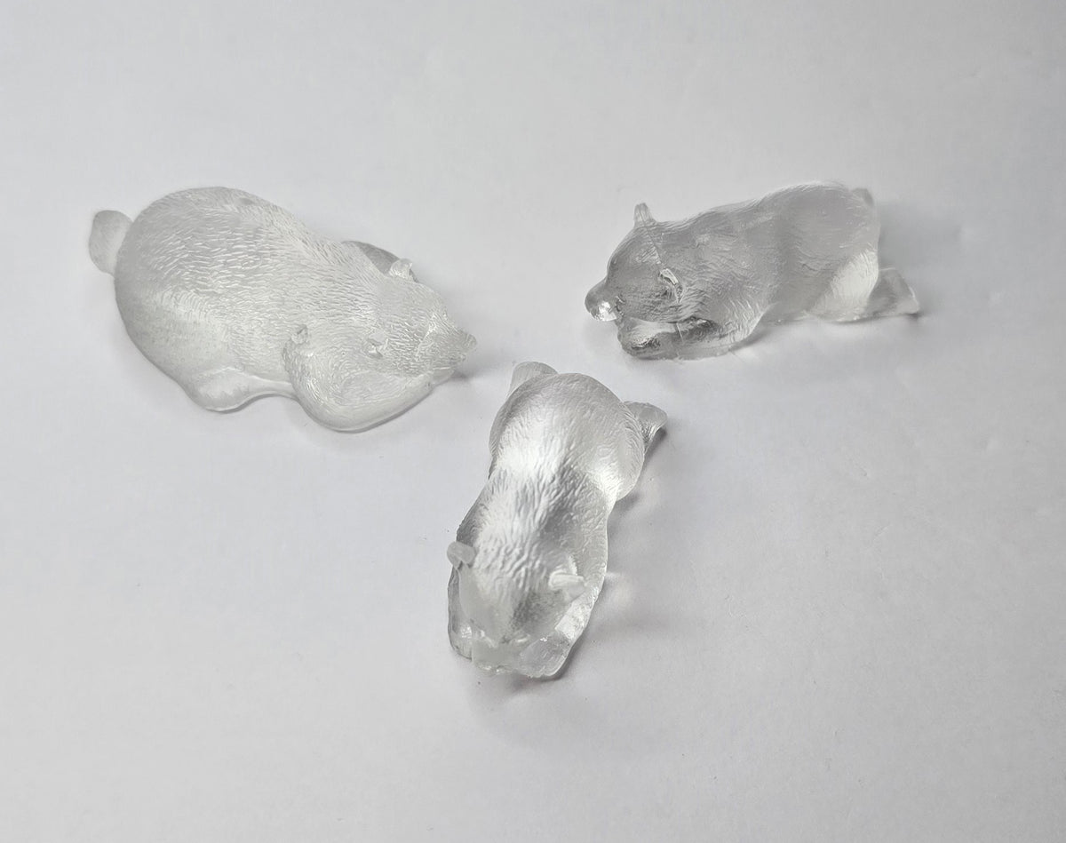 3 clear bear figurines