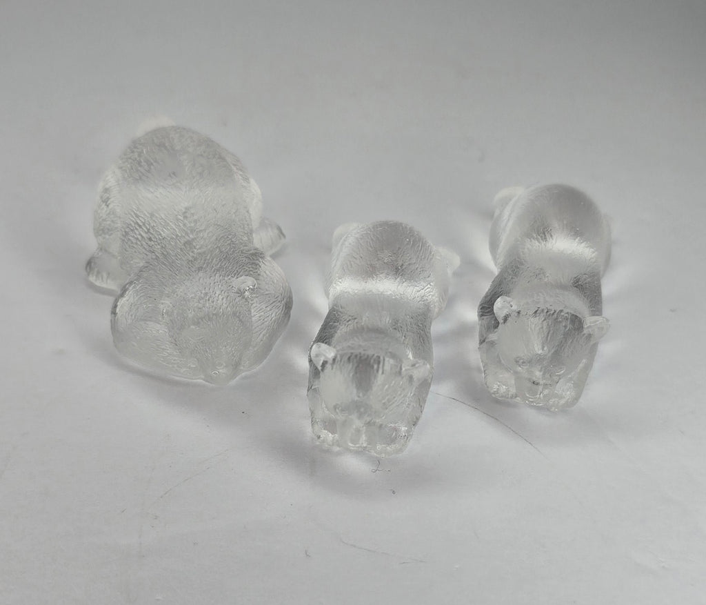 3 clear bear figurines