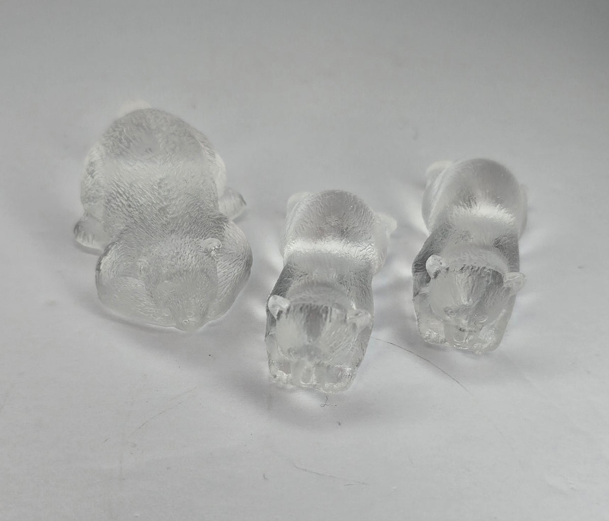 3 clear bear figurines
